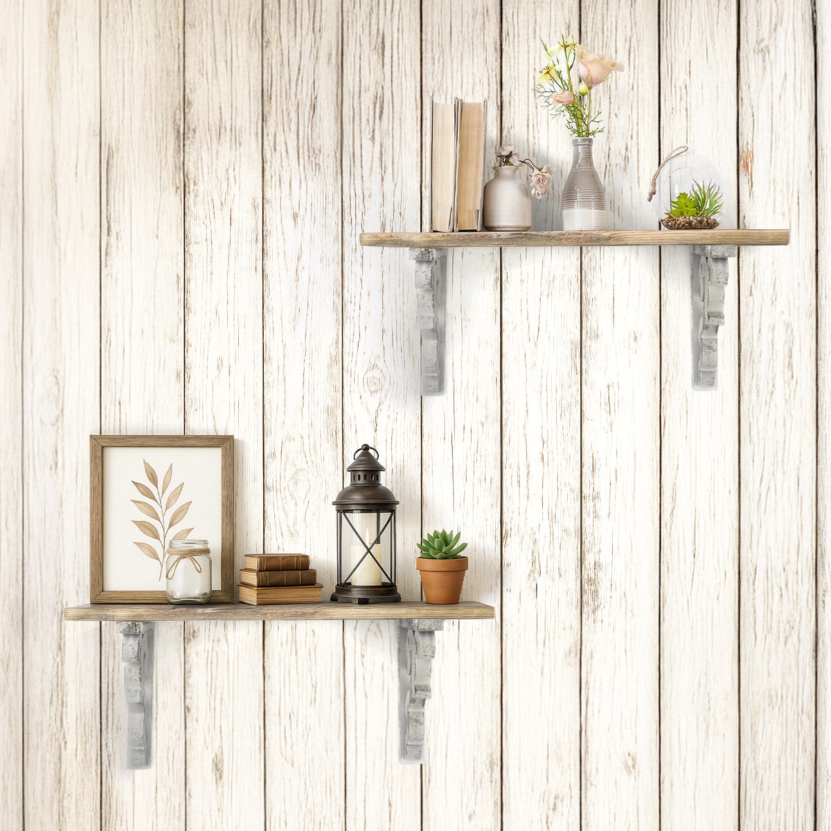 Set of two 12-inch washed white wood corbels with distressed floral scrollwork and dual keyhole slots, styled as farmhouse shelf brackets and architectural wall accents.