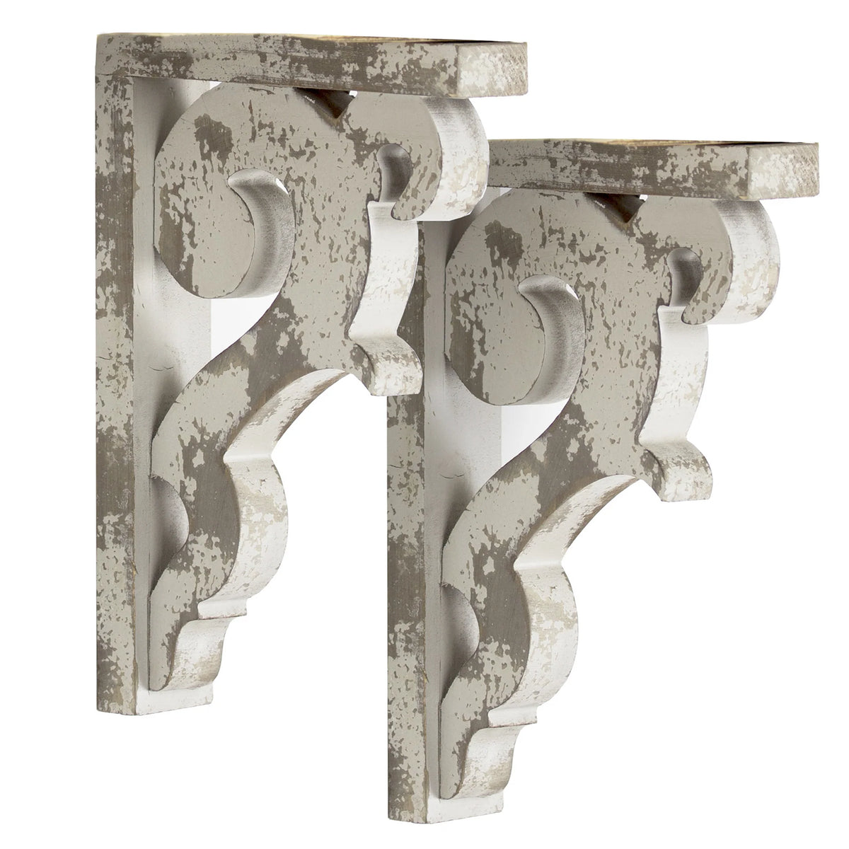 Set of two 12-inch washed white wood corbels with distressed floral scrollwork and dual keyhole slots, styled as farmhouse shelf brackets and architectural wall accents.