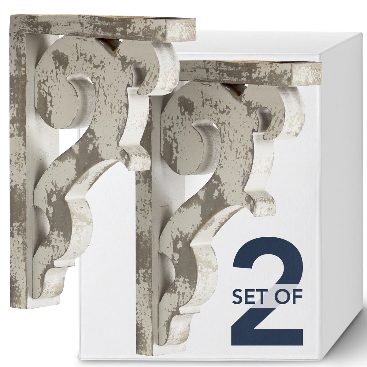 Set of two 12-inch washed white wood corbels with distressed floral scrollwork and dual keyhole slots, styled as farmhouse shelf brackets and architectural wall accents.