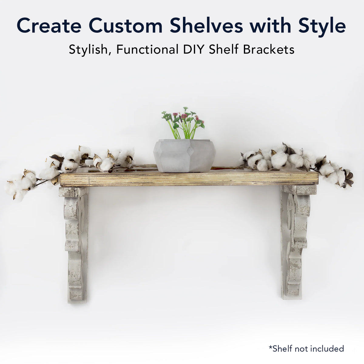 Set of two 12-inch washed white wood corbels with distressed floral scrollwork and dual keyhole slots, styled as farmhouse shelf brackets and architectural wall accents.