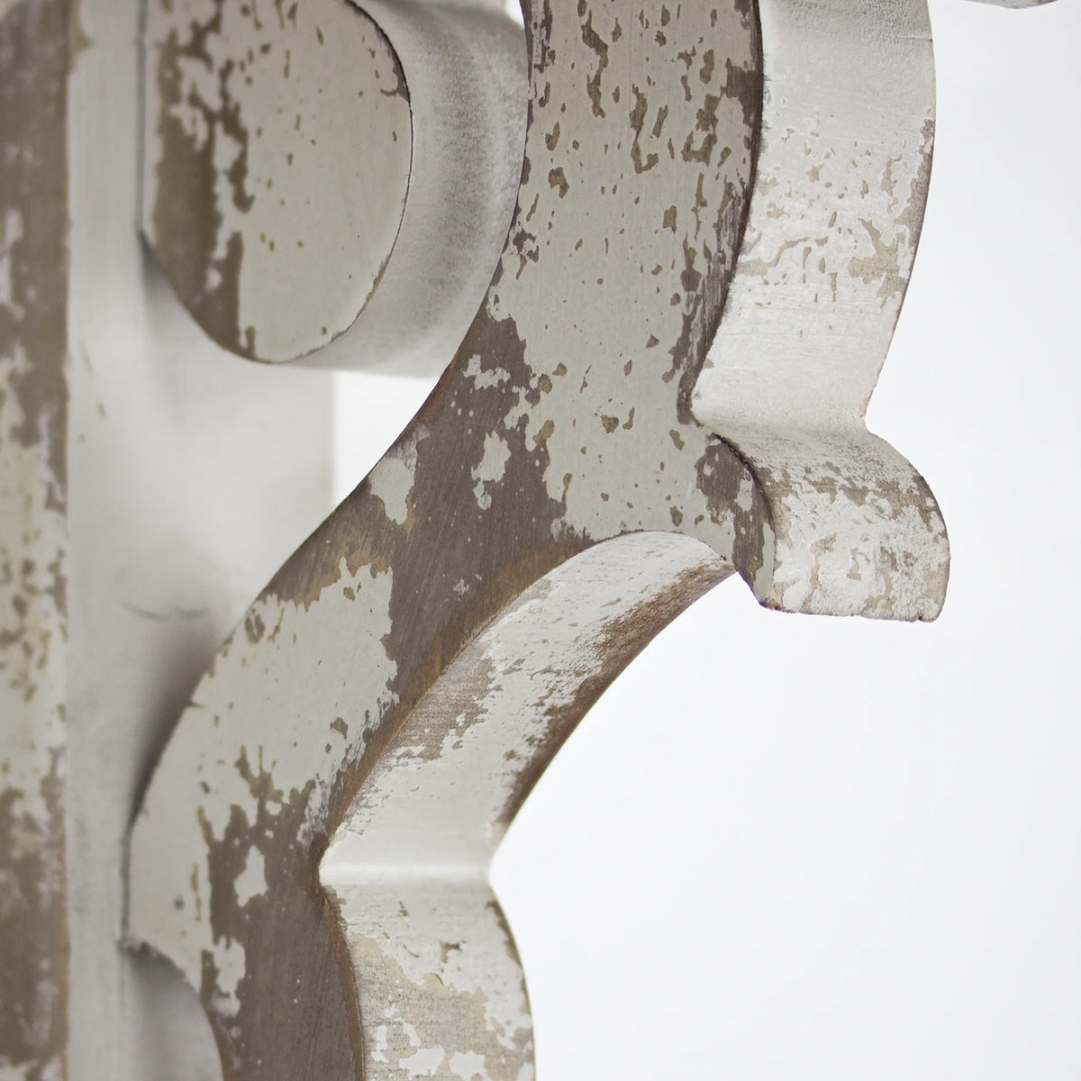 Set of two 12-inch washed white wood corbels with distressed floral scrollwork and dual keyhole slots, styled as farmhouse shelf brackets and architectural wall accents.