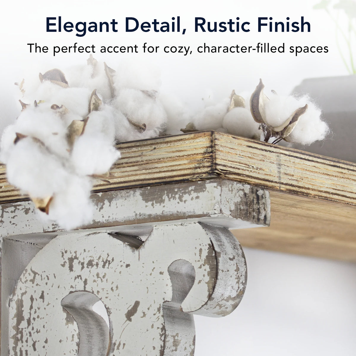 Set of two 12-inch washed white wood corbels with distressed floral scrollwork and dual keyhole slots, styled as farmhouse shelf brackets and architectural wall accents.