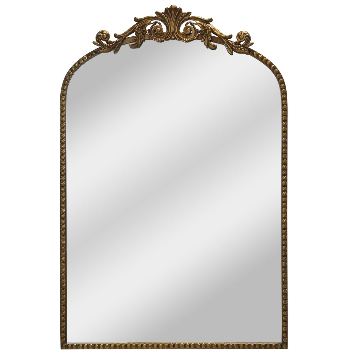 A compact 20 x 30 antique gold arched wall mirror with filigree crest and beaded trim, displayed vertically above a vanity for grooming in a warm dressing space.