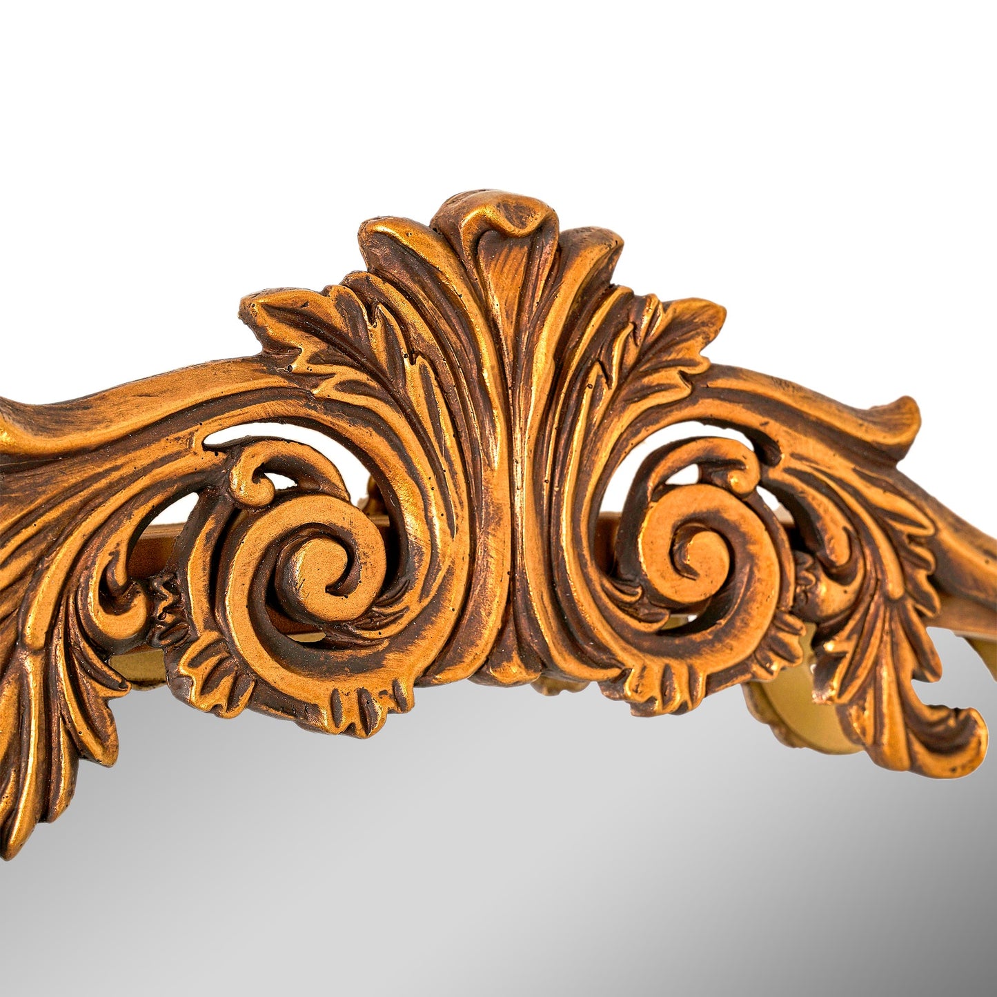 A slim 22 x 64 antique gold arched full body mirror with ornate filigree crest and floral-bead border, leaning beside a dresser and closet in a warm bedroom.