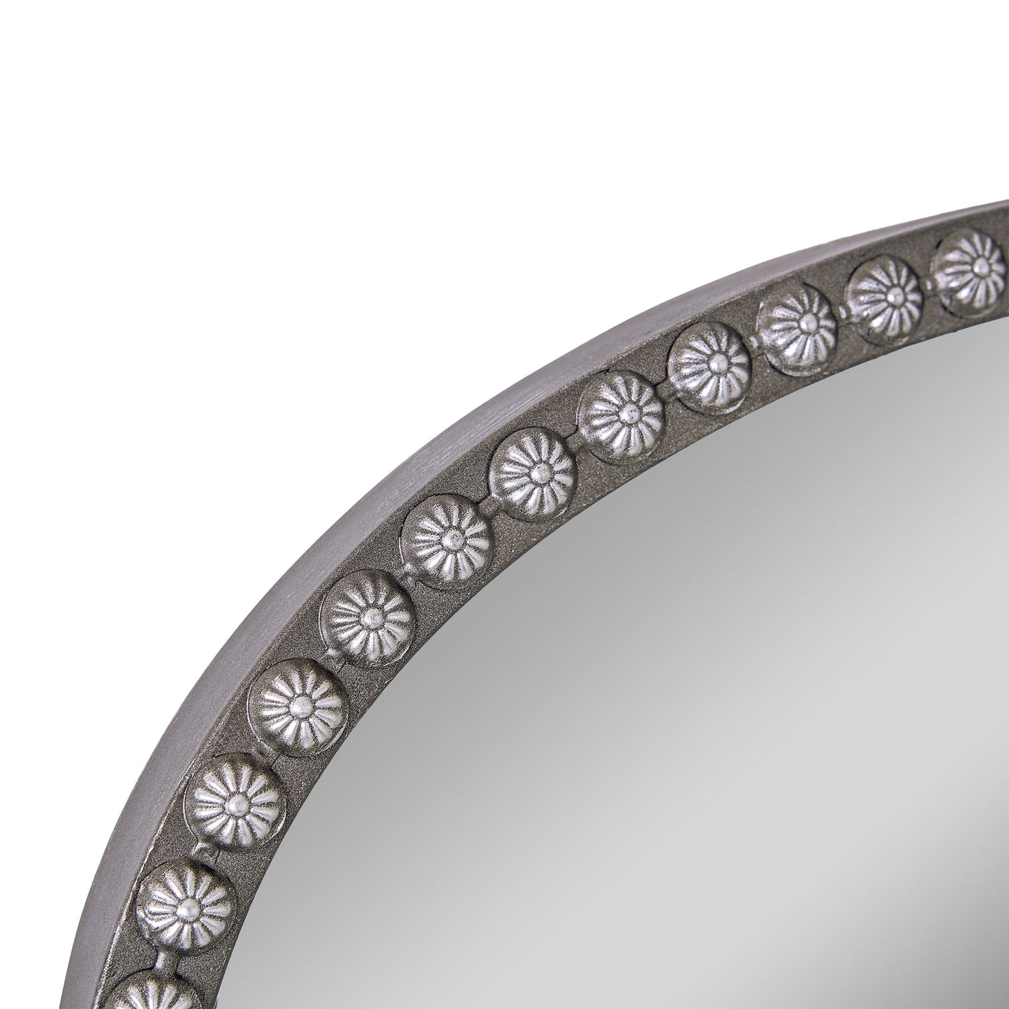 A 24 x 34 pewter arched wall mirror with antique silver filigree crest and beaded trim, displayed horizontally above a vanity or console in a polished neutral interior.