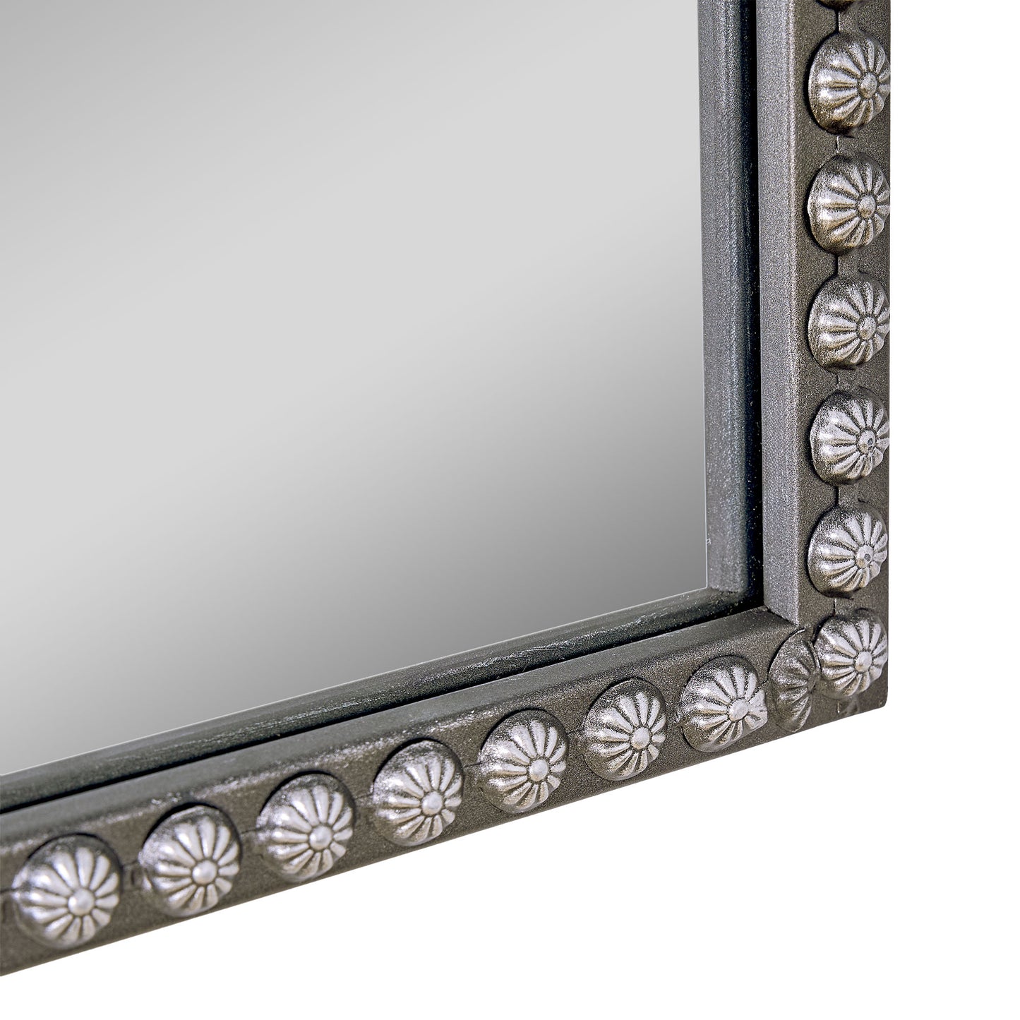 A 24 x 34 pewter arched wall mirror with antique silver filigree crest and beaded trim, displayed horizontally above a vanity or console in a polished neutral interior.