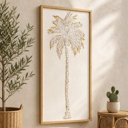 A tall white and gold embossed metal palm tree wall art with textured 3D detailing in a light wood frame, styled as coastal boho decor for living room, bathroom, or bedroom walls.