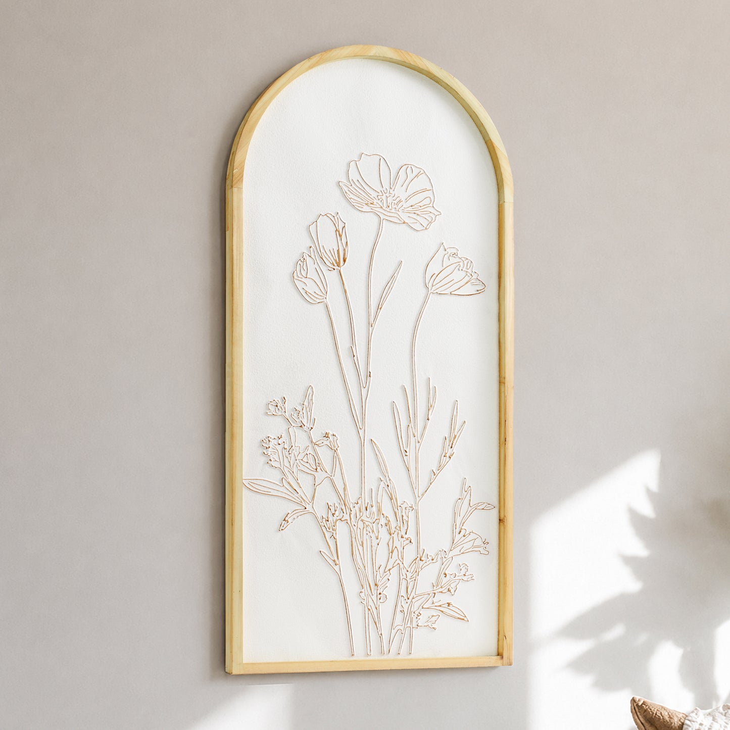 White and gold embossed floral wall art in an arched frame with 3D metal detailing, styled as neutral boho coastal decor for living room, bedroom, bathroom, or hallway.