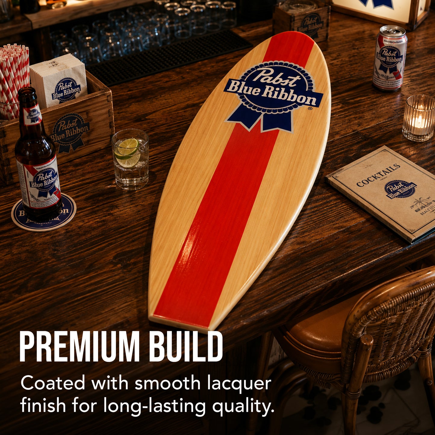 Officially licensed Pabst Blue Ribbon surfboard wall plaque featuring the iconic PBR logo on a natural wood-look MDF surfboard, perfect for home bars, man caves, garages, beach houses, and coastal décor.