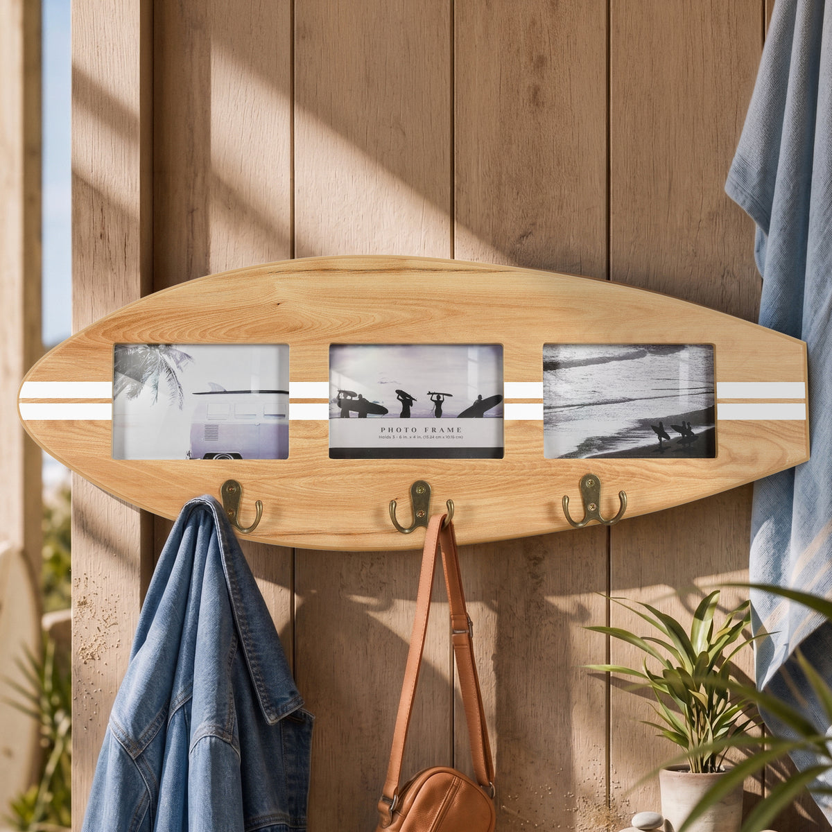Wood grain surfboard photo collage frame with white stripes, three 6 x 4 photo openings and three antique brass double hooks for coastal entryway wall decor.