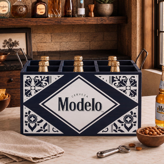 Officially licensed Modelo Cerveza black wooden six bottle storage crate with divided compartments and metal handles displayed as a rustic beer caddy for home bars, kitchens, cabins, and man caves.